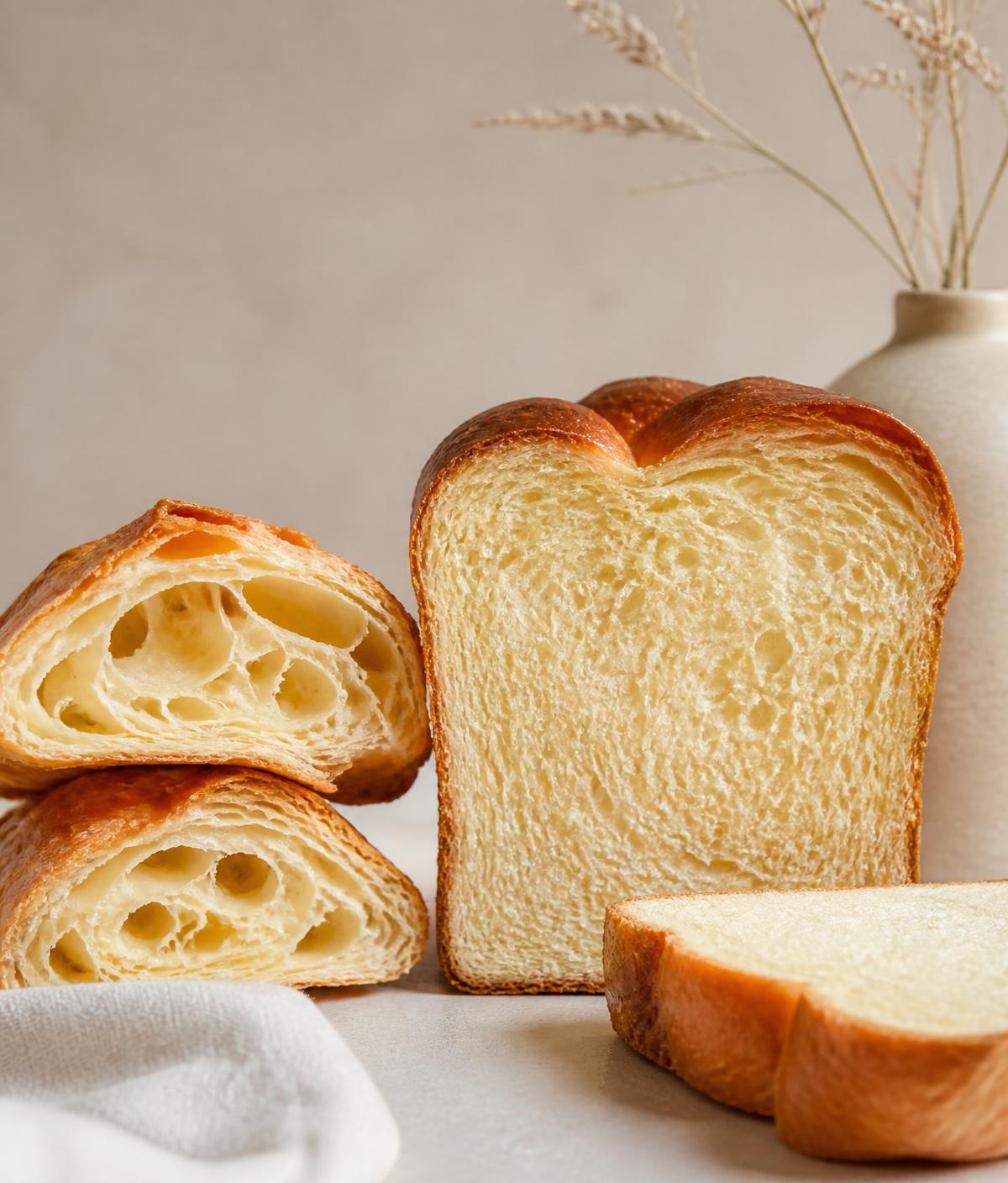 Sliced brioche and laminated pastry showing open crumb structure